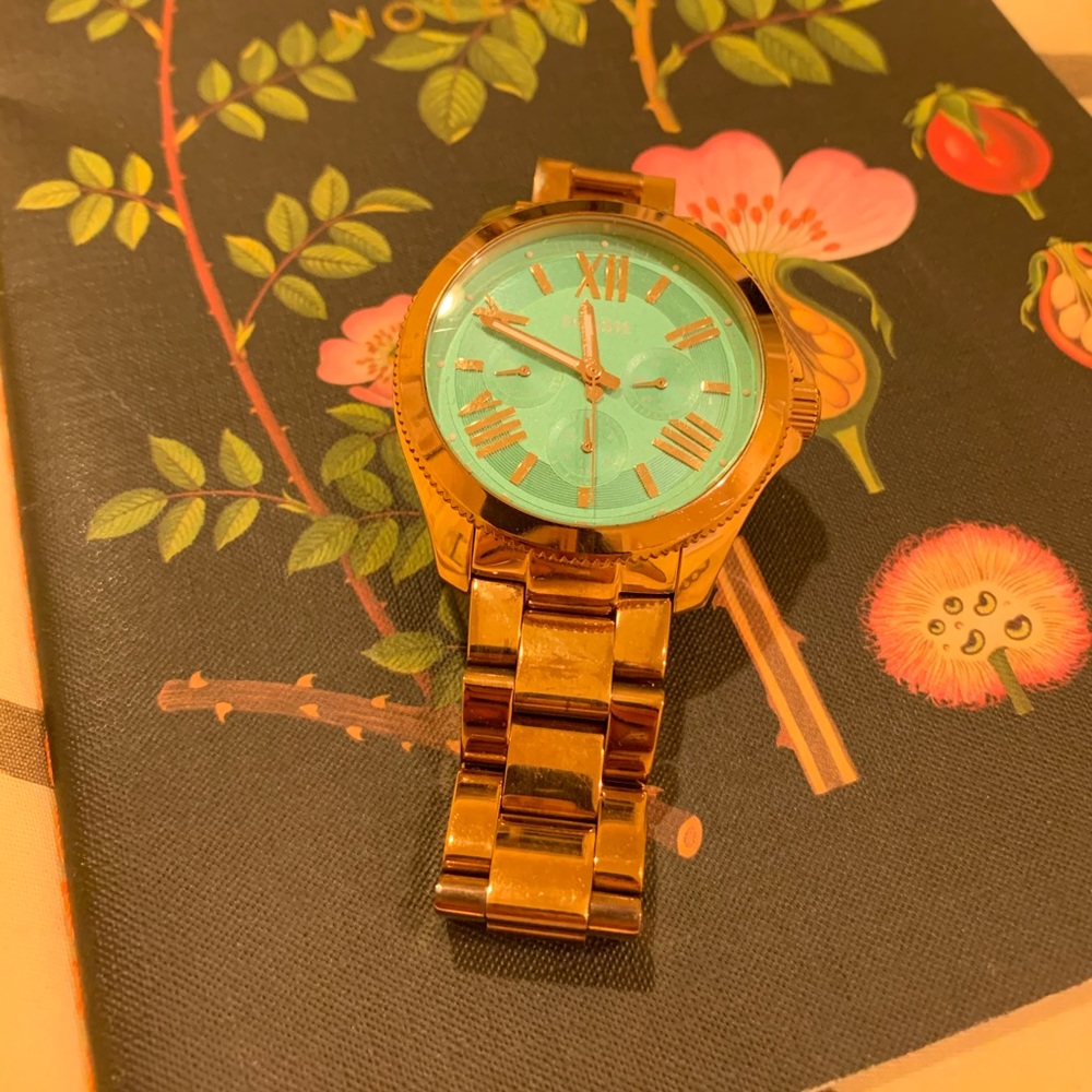 Gold Fossil watch with teal face